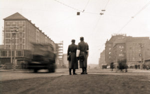 Two People's Police officers watch the morning traffic on Prager Strasse in Dresden Two People's Police officers watch the morning traffic on Prager Strasse in Dresden